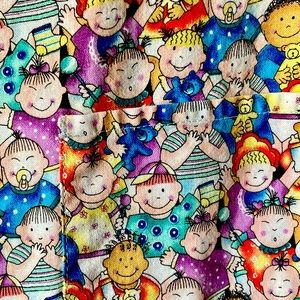 Barco multi print 100% cotton size medium scrub jacket.  3pockets. Teal cuffs.